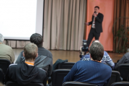 The audience listens to the acting in a conference hall.の写真素材