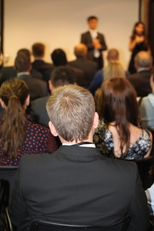 The audience listens to the acting in a conference hallの写真素材