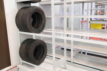The image of car wheels stands on the shelves at the warehouseの写真素材