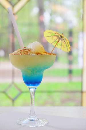 Blue cocktail in a glass isolated on a white backgroundの写真素材