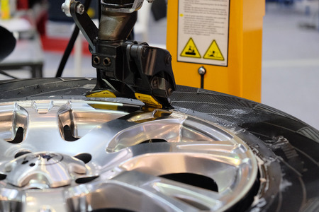 The image of tyre fitting machine under the white backgroundの写真素材