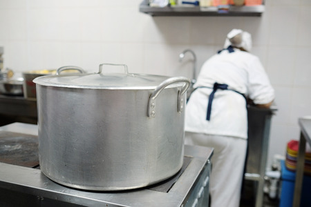 Large saucepan on the stove in the culinary workshopの写真素材