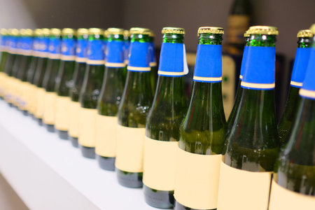 Beer bottles in a rowの写真素材