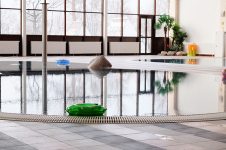 green swimming laps in the indoor swimming poolのeditorial素材