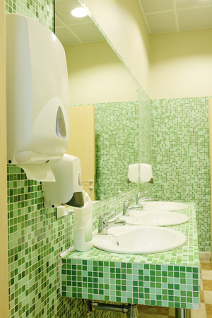 Public empty restroom with washstands and mirrorのeditorial素材
