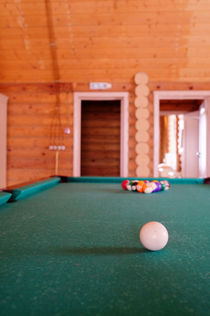 White billiard ball on a green billiard tableのeditorial素材