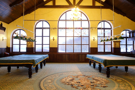 Covered pool table in the billiard roomのeditorial素材
