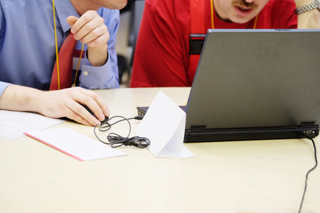 The image of a human hand on computer mouse