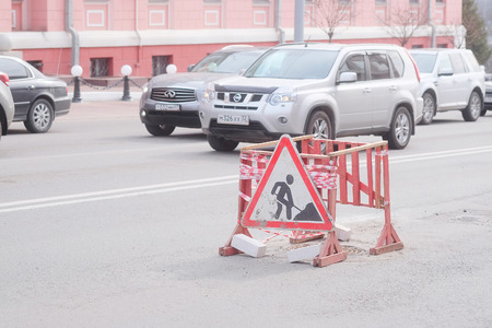 Bryansk, Russia, March, 28, 2015: traffic jams in Bryansk and fence of road repairのeditorial素材