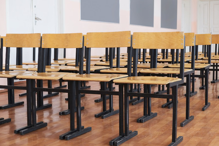 Rows of wooden chairs in the hallの写真素材