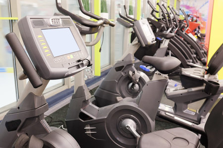 Modern interior of a fitness club gym with sport equipment modern interior