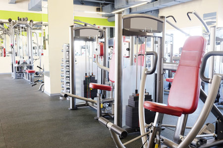 Modern interior of a fitness club gym with sport equipment modern interior