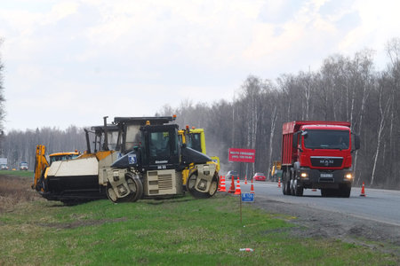 The equipment works at repair of the road