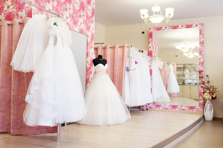 Wedding dresses in a show-room of a wedding salonの写真素材
