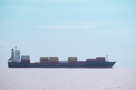 The image of a cargo ship in a open seaの写真素材