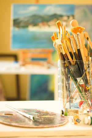 Painting with brushes and paletteの写真素材