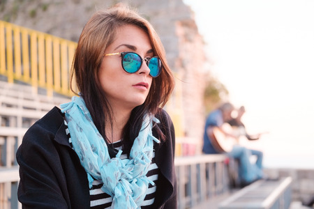 Portrait of a young girl listening the musicの写真素材