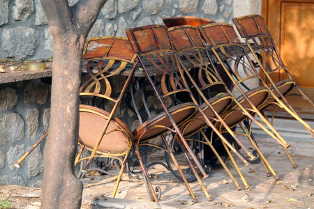 Chairs stands near the table in a street cafeの写真素材