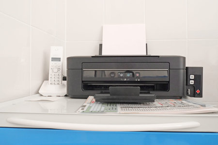 Black printer and paper closeup