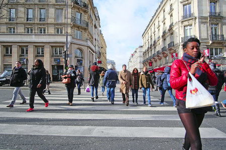 Paris, France, February 9, 2016: pedestrian cross road in a center of Paris, Franceのeditorial素材