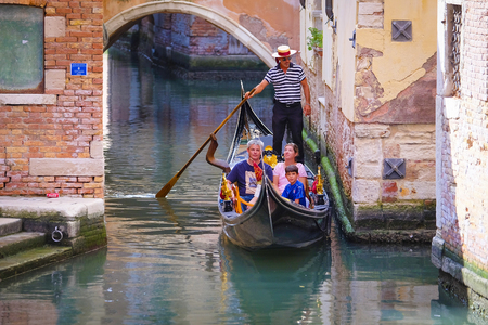 Venice, Italy, June, 21, 2016: gondola sails down the channel in Venice, Italy. Gondola is a traditional transport in Venice, Italyのeditorial素材