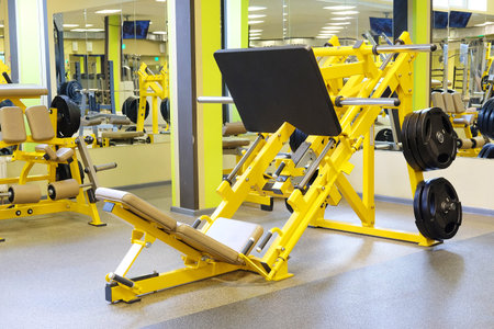 Interior of a fitness hall with wights and other sport equipment