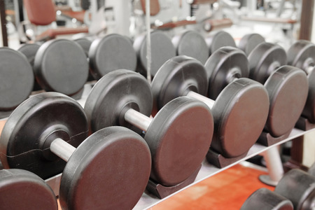 The image of dumbbells on a standの写真素材