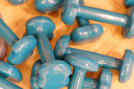 The image of dumbbells in a fitness hall
