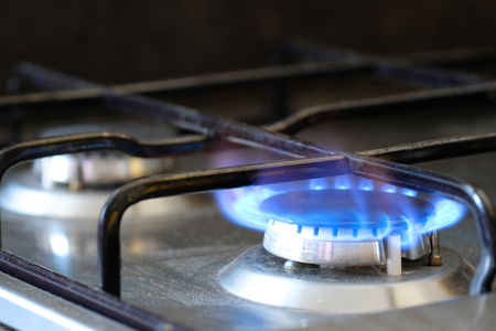 Fire on a kitchen gas stoveの写真素材