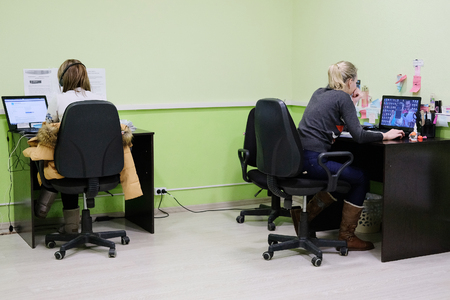 Moscow, Russia - December, 12, 2016: girls secretary work in an office in a car repair station in Moscow, Russiaのeditorial素材