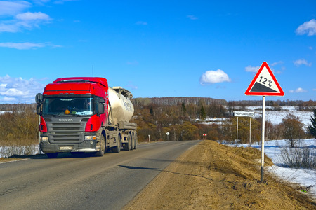 Kaluga region, Russia - March, 5, 2017: Truck drives down the spring country road in Kaluga region, Russiaのeditorial素材