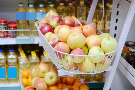 Apples in a basket in supermarketの写真素材