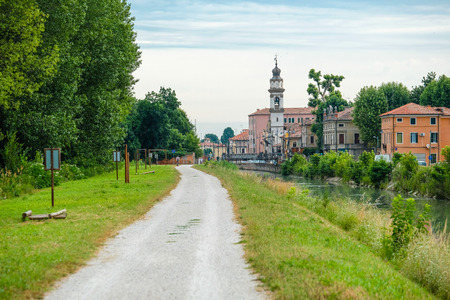 Battaglia Terme, Italy - June, 27, 2017: bank of a city channel in Battaglia Terme, Italyの写真素材