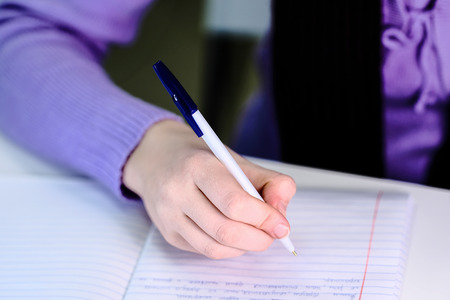 Pen in a girl's handの写真素材