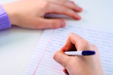 Pen in a girl's handの写真素材