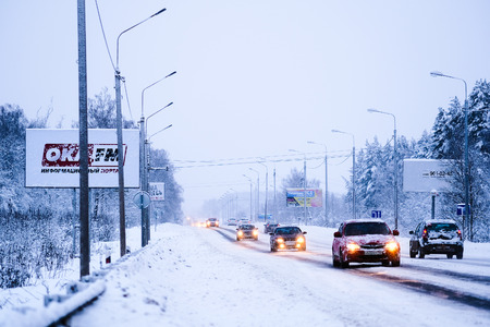 Moscow region, Russia - February, 25, 2018: cars drive down the snow-covered road in Moscow region, Russiaのeditorial素材