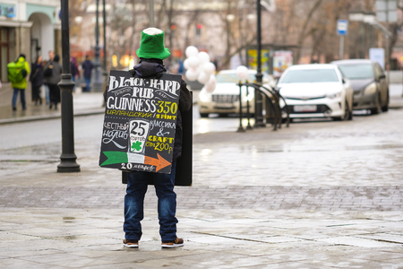 Moscow, Russia - April, 2, 2018: promoter stands with an  advertisement in Mosocwのeditorial素材