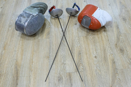 Sport rapiers and helmets close upの写真素材