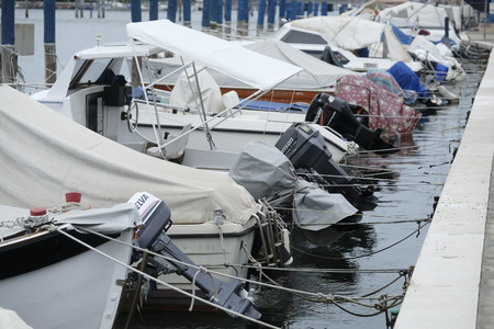 Sottomarina, Italy - July, 11, 2018: boats parked near embankment in Sottomarina, Italyのeditorial素材