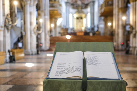 Parma, Italy - July, 9, 2018: interior of Parma Cathedral in Parma with Bible on a frontground, Italyのeditorial素材