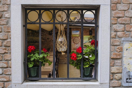 Venice, Italy - Jine, 28, 2018: window of a cafe in a center of Venice, Italyのeditorial素材