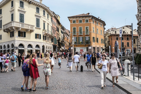 Verona, Italy - July, 15, 2018: tourists on a street in a center of Verona, Italyのeditorial素材