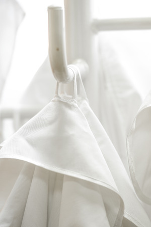 White lab dressings gown on a hangerの写真素材