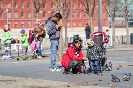 Moscow, Russia - April, 1, 2019: people with a child on a street in Moscow, Russiaのeditorial素材