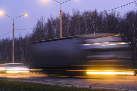 truck on a highway in Moscow region at eveningの写真素材