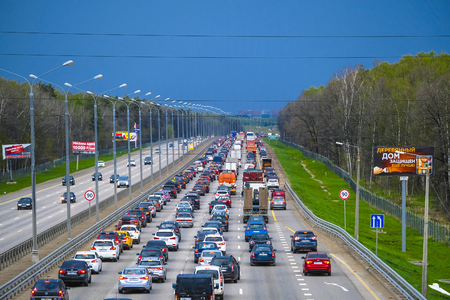 East Butovo, Moscow region, Russia - May, 6, 2019: weekend traffic jam on a highway in Moscow region, Russia before rainstormのeditorial素材