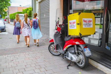 Sotomarina, Italy - July, 11, 2019: cargo motocicles on a parking in Sotomarina, Italyのeditorial素材