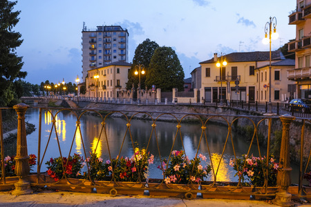 Adria, Italy - July, 07, 2019: cityscape with the image of channel in Adria, Italy in the eveningのeditorial素材