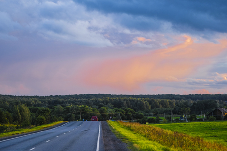 Moscow region, Russia - August, 9, 2019: Country road in Moscow region at sunsetのeditorial素材