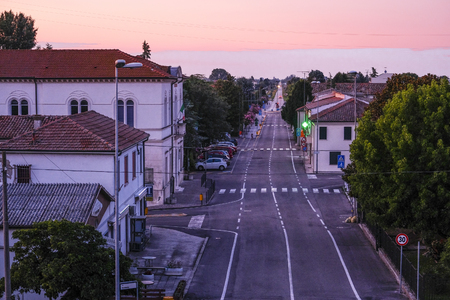 Rovigo, Italy - July, 26, 2019: landscape with the image of a road in Italy at sunsetのeditorial素材